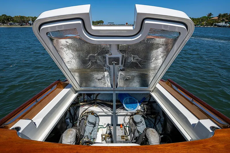 Slide: The Image of Open engine compartment of 2017 Hinckley Talaria 34R boat on water. - 15