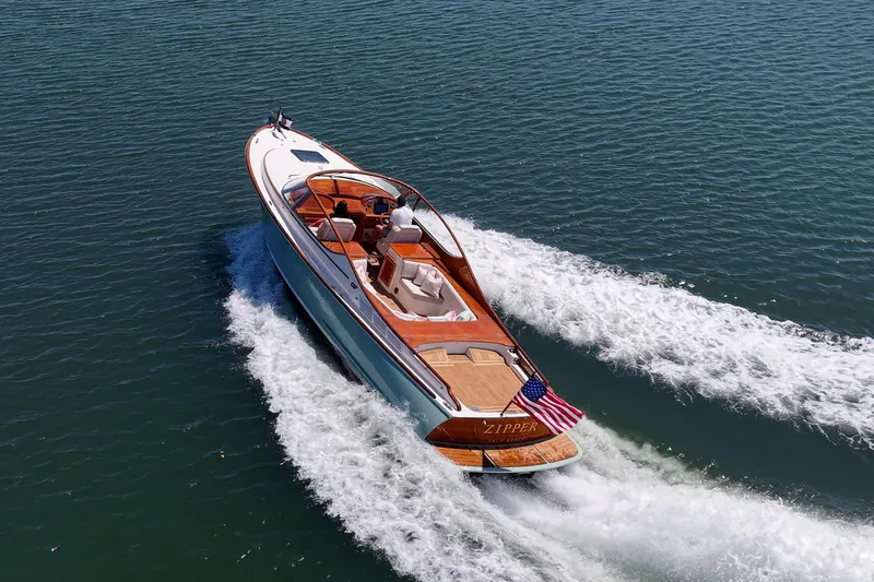 Slide: The Image of 2017 Hinckley Talaria 34R cruising on open water, showcasing elegant design and craftsmanship. - 27