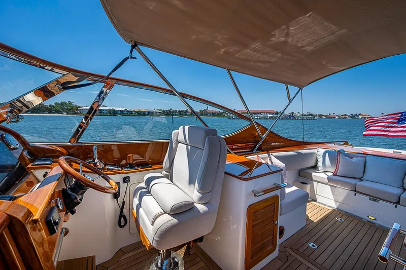 Slide: The Image of Luxurious 2017 Hinckley Talaria 34R yacht interior with elegant seating and scenic water view. - 7