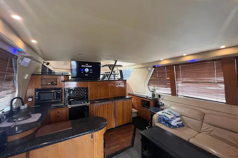 Slide: The Image of Luxurious interior of 2000 Carver 530 Voyager Pilothouse yacht with modern amenities. - 10