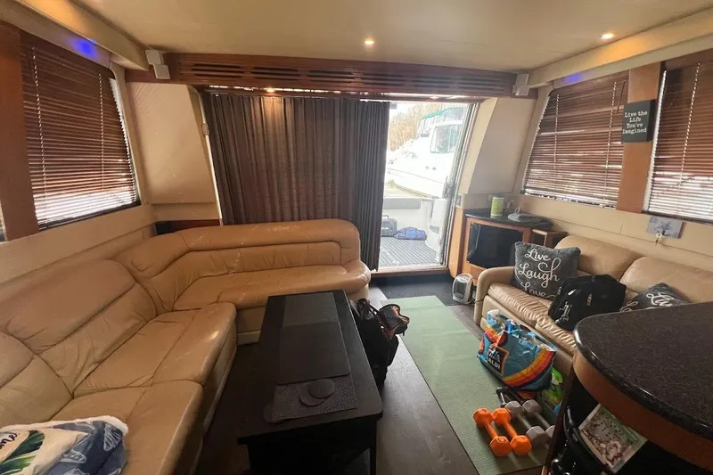 Slide: The Image of Luxurious interior of 2000 Carver 530 Voyager Pilothouse with leather seating and modern decor. - 14