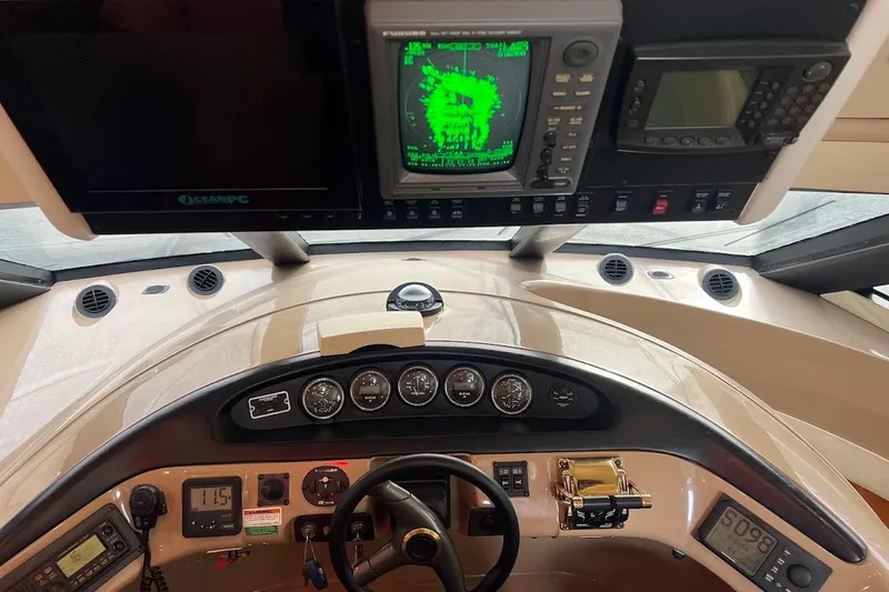 Slide: The Image of Pilothouse interior of 2000 Carver 530 Voyager with navigation equipment and steering controls. - 17