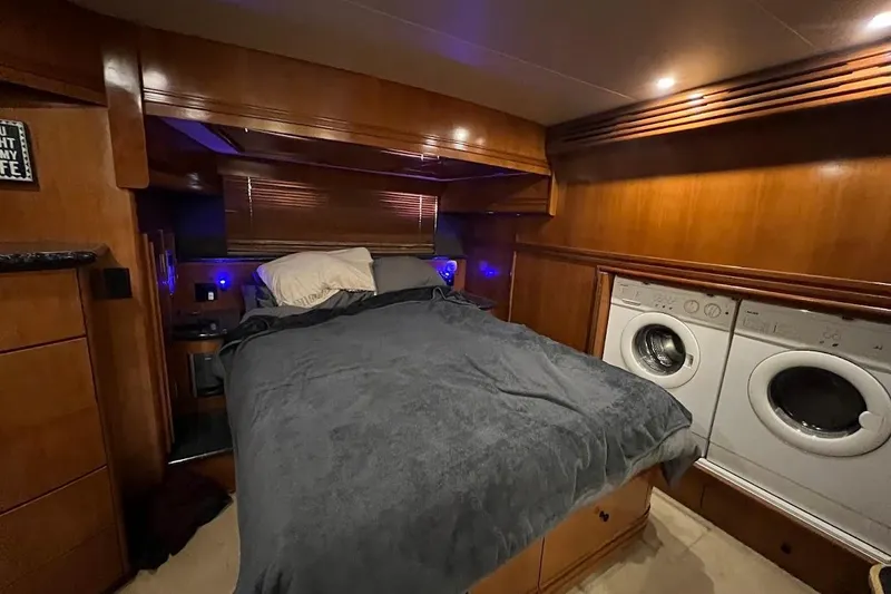 Slide: The Image of Luxurious bedroom with washer and dryer in 2000 Carver 530 Voyager Pilothouse yacht. - 20