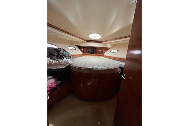 Slide: The Image of Interior cabin of 2000 Carver 530 Voyager Pilothouse with bed and portholes. - 21