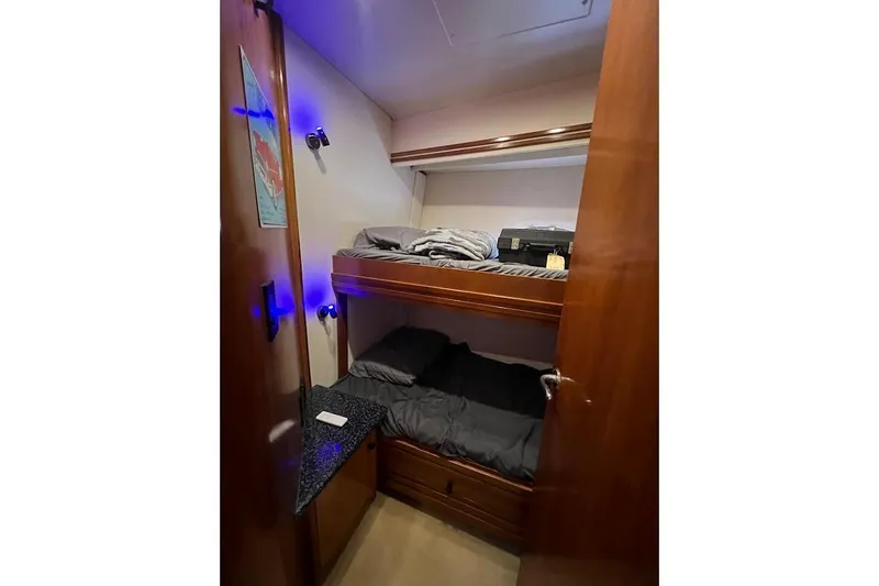 Slide: The Image of Bunk beds in 2000 Carver 530 Voyager Pilothouse cabin with wooden interior. - 23