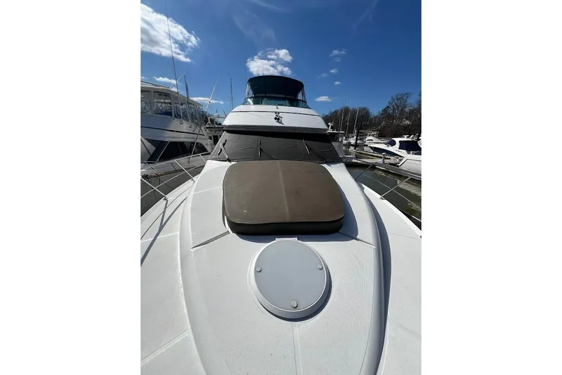 Slide: The Image of 2000 Carver 530 Voyager Pilothouse yacht docked under clear blue sky. - 5
