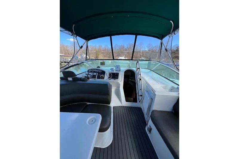 Slide: The Image of Interior view of 2000 Carver 530 Voyager Pilothouse with seating and helm. - 8