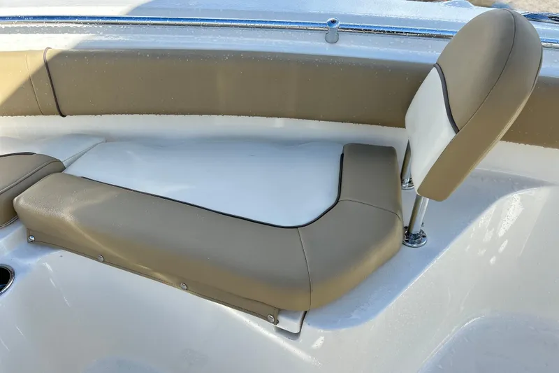 Slide: The Image of 2019 Key West 239 FS boat seating with tan and white upholstery. - 12