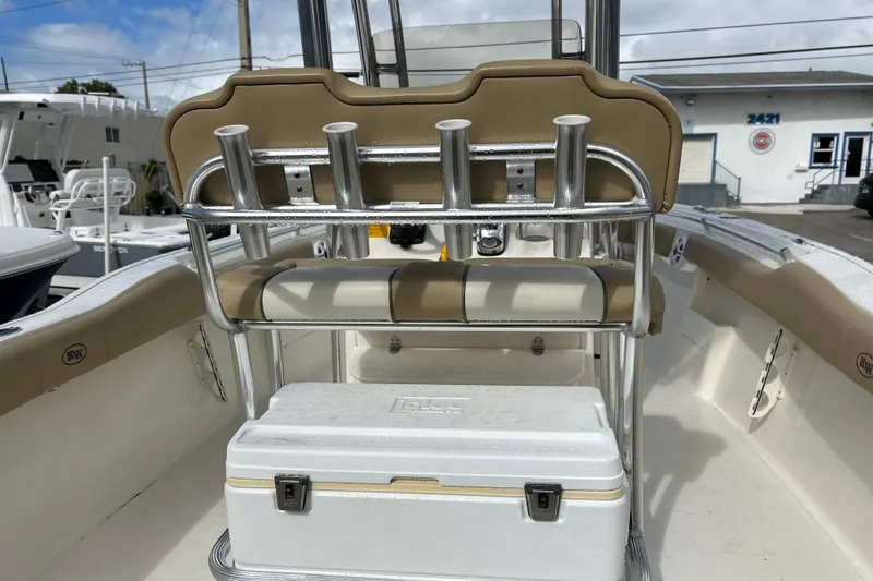 Slide: The Image of 2019 Key West 239 FS boat interior with rod holders and cooler. - 17