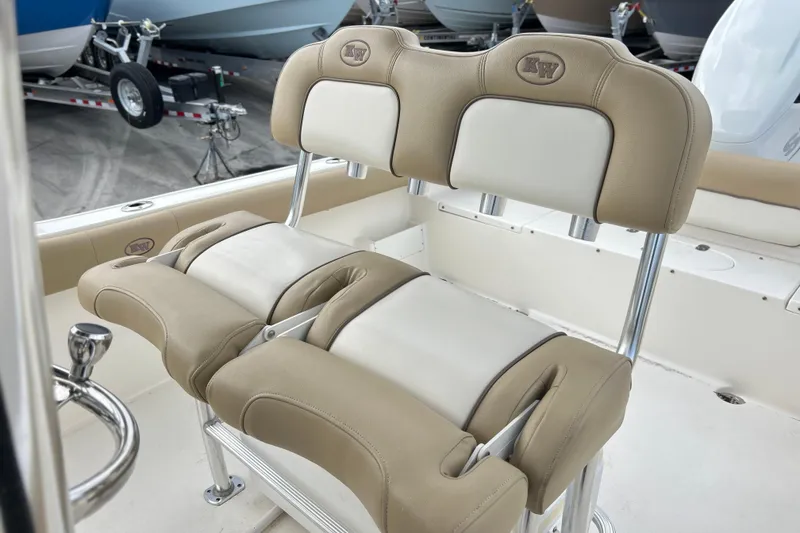 Slide: The Image of 2019 Key West 239 FS boat seating with beige and white upholstery. - 7