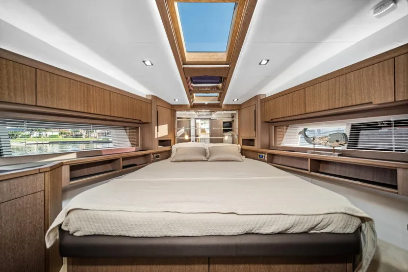 Slide: The Image of Luxurious interior of 2019 Galeon 560 Sky yacht with skylight and wood finish. - 10