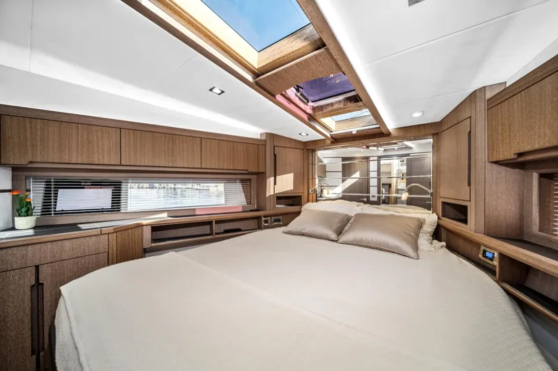 Slide: The Image of Luxurious interior of 2019 Galeon 560 Sky yacht with skylight and elegant wood finish. - 11