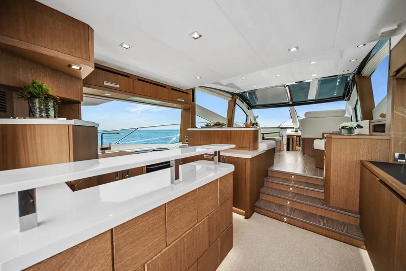 Slide: The Image of Luxurious interior of 2019 Galeon 560 Sky yacht with modern wood finishes and ocean view. - 19