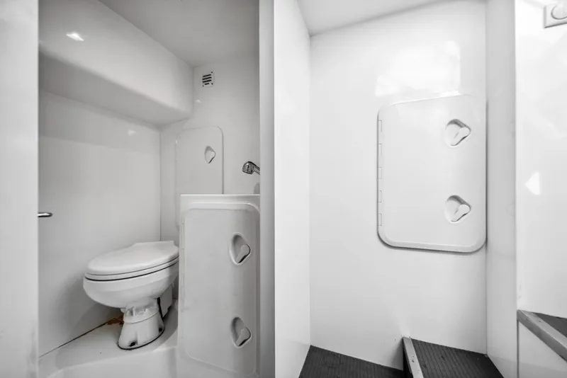 Slide: The Image of Modern bathroom in 2019 Galeon 560 Sky yacht, featuring sleek white design and compact layout. - 23