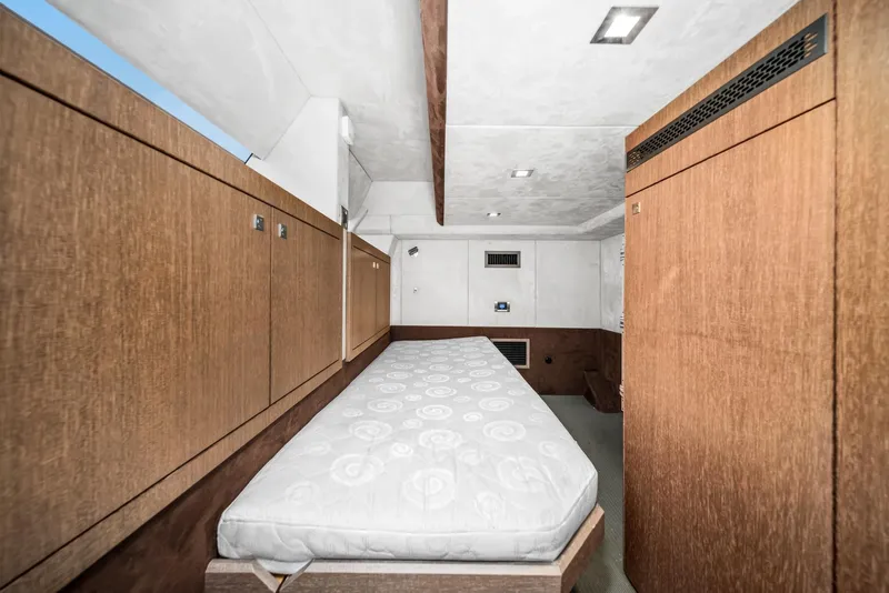 Slide: The Image of Interior cabin of 2019 Galeon 560 Sky yacht with wooden cabinetry and single bed. - 24