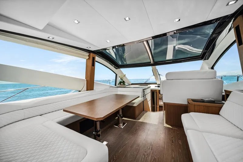 Slide: The Image of Luxurious interior of 2019 Galeon 560 Sky yacht with panoramic windows and elegant seating. - 3