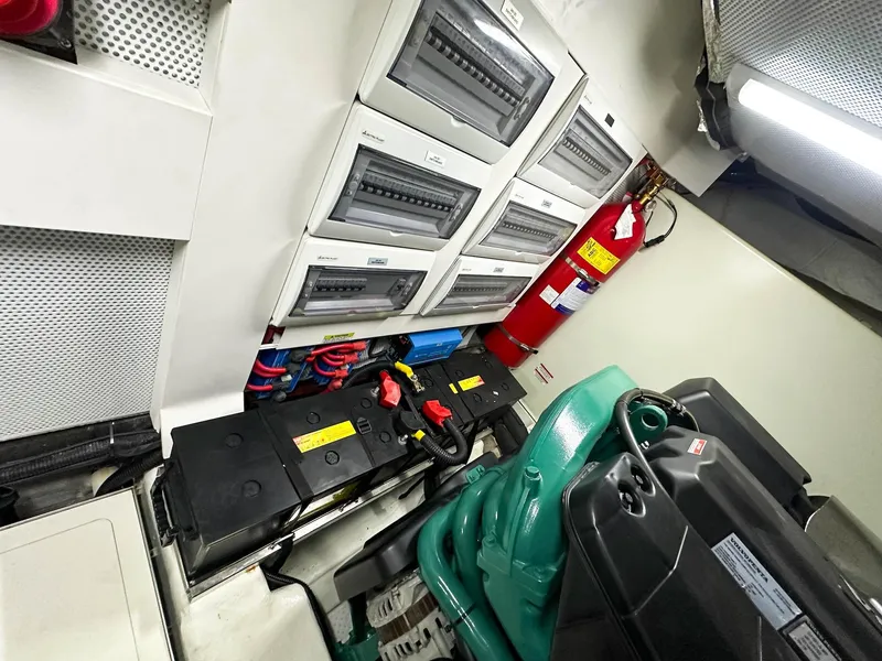 Slide: The Image of Engine room of 2019 Galeon 560 Sky yacht with electrical panels and fire extinguisher. - 31