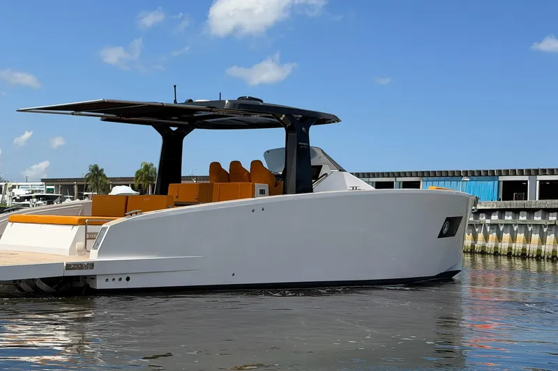 Slide: The Image of 2024 Tesoro T40 luxury yacht docked, featuring sleek design and modern amenities. - 11