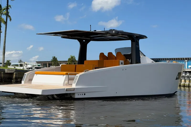 Slide: The Image of 2024 Tesoro T40 luxury yacht with sleek design and spacious deck on calm water. - 12