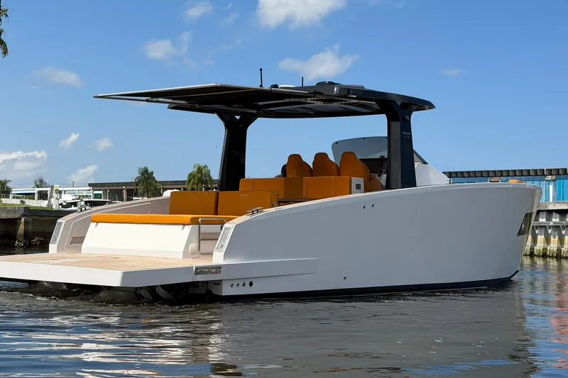 Slide: The Image of 2024 Tesoro T40 luxury yacht with sleek design and spacious deck on calm water. - 13