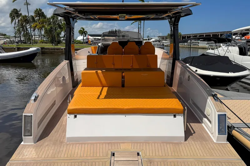 Slide: The Image of 2024 Tesoro T40 luxury yacht with orange seating, docked at a marina. - 16
