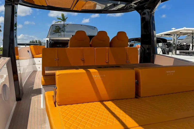 Slide: The Image of 2024 Tesoro T40 luxury yacht with vibrant orange seating and sleek design. - 19
