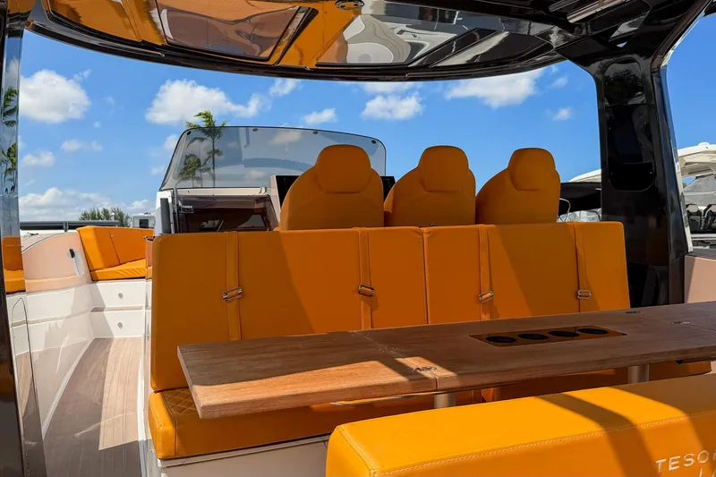 Slide: The Image of Luxurious 2024 Tesoro T40 yacht interior with vibrant orange seating and sleek design. - 20