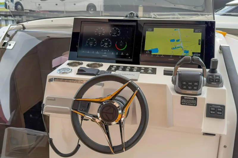 Slide: The Image of 2024 Tesoro T40 boat dashboard with Garmin navigation and control systems. - 23