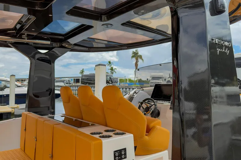 Slide: The Image of Luxurious 2024 Tesoro T40 yacht interior with orange seating and sleek design. - 29