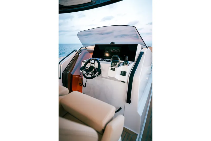 Slide: The Image of 2024 Tesoro T40 yacht helm with modern controls and ocean view. - 3