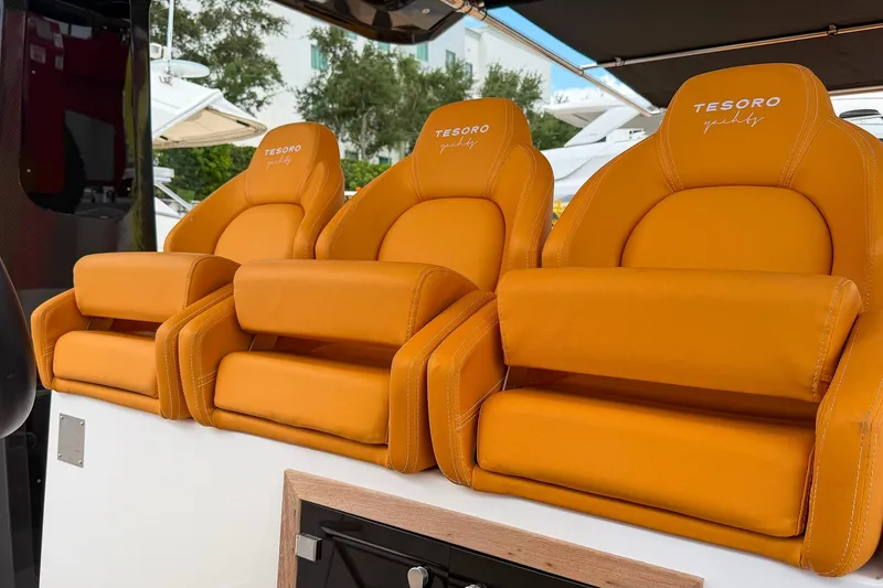 Slide: The Image of Orange leather seats on a 2024 Tesoro T40 yacht, showcasing luxury and comfort. - 30