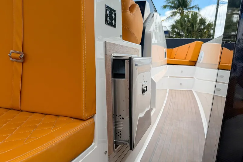 Slide: The Image of 2024 Tesoro T40 boat interior with orange seating and sleek design elements. - 33