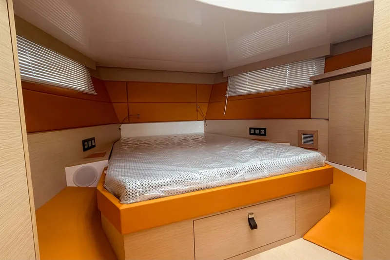 Slide: The Image of Luxurious cabin interior of 2024 Tesoro T40 yacht with modern design and cozy bed. - 35
