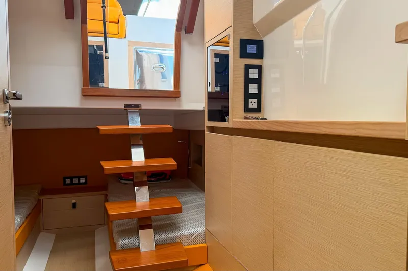 Slide: The Image of Interior of 2024 Tesoro T40 yacht featuring modern wooden steps and sleek design elements. - 37