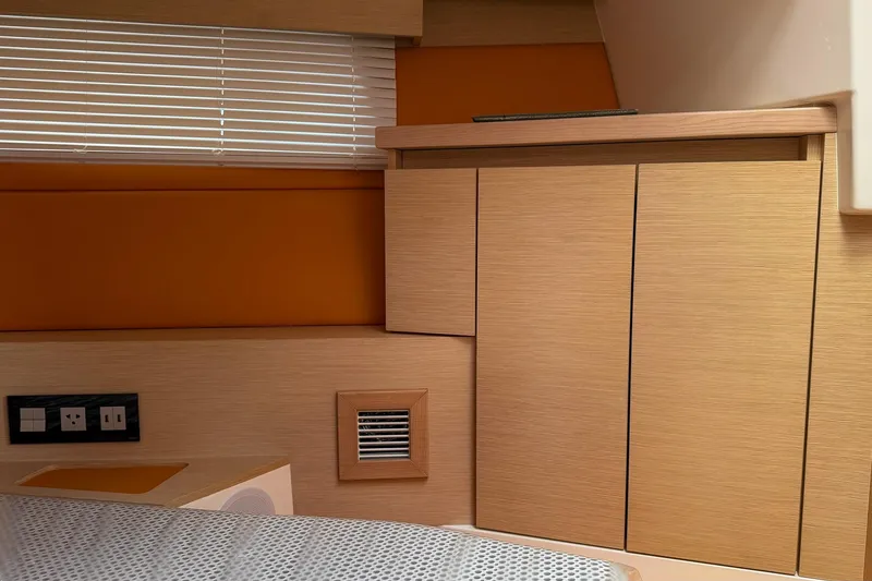 Slide: The Image of 2024 Tesoro T40 interior with wooden cabinetry, blinds, and electrical outlets. - 38