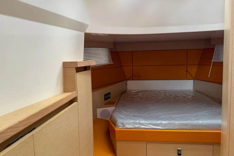 Slide: The Image of 2024 Tesoro T40 yacht interior cabin with modern design and cozy bed. - 39
