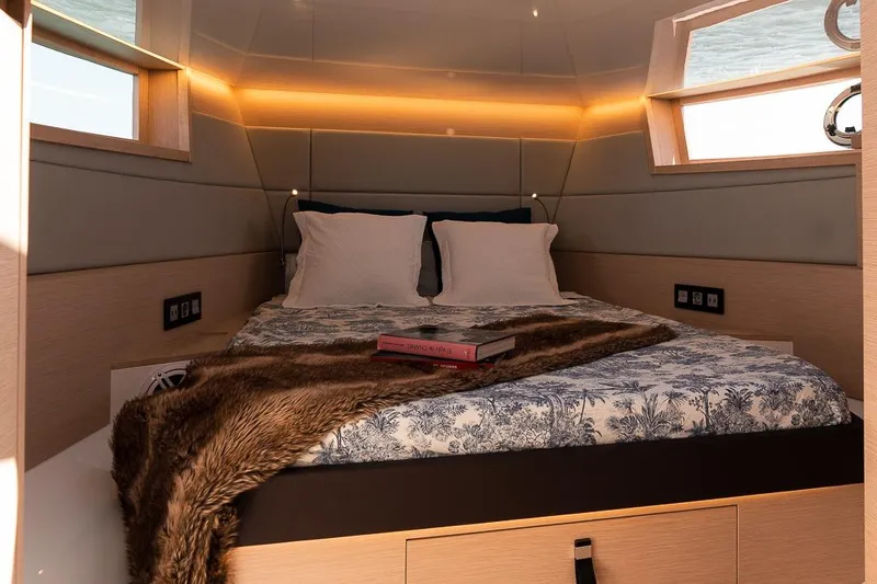 Slide: The Image of Luxurious 2024 Tesoro T40 yacht cabin with cozy bed and elegant decor. - 4
