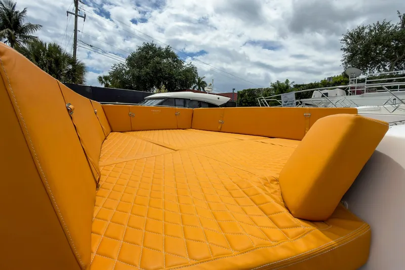 Slide: The Image of Luxurious orange seating on 2024 Tesoro T40 boat under cloudy sky. - 45