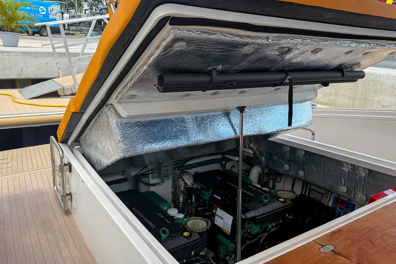 Slide: The Image of Open engine compartment of 2024 Tesoro T40 boat, showcasing modern engine design. - 52