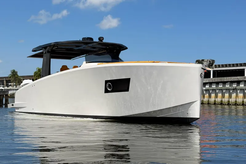 Slide: The Image of 2024 Tesoro T40 luxury yacht on calm water, showcasing sleek design and modern features. - 7