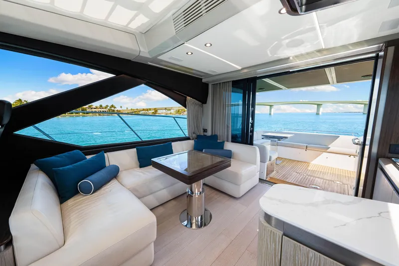 Slide: The Image of Luxurious interior of 2020 Azimut S6 yacht with ocean view and elegant seating area. - 92