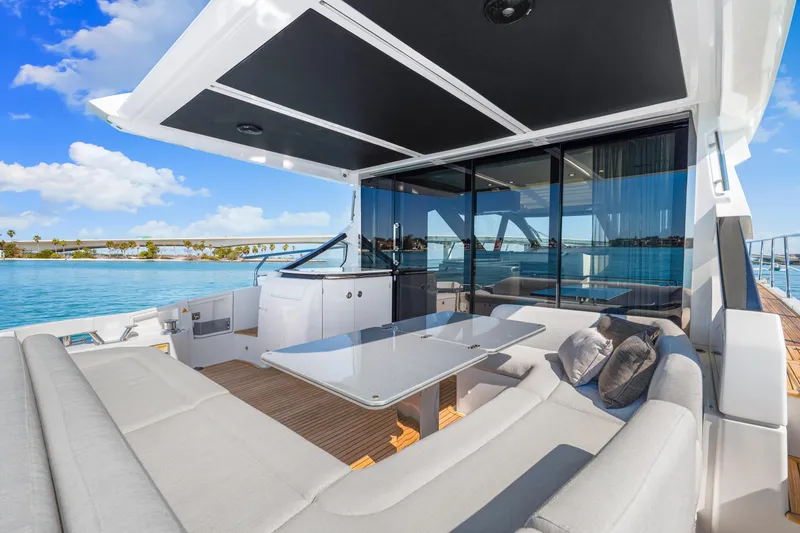 Slide: The Image of Luxurious 2020 Azimut S6 yacht with elegant outdoor seating and ocean view. - 81
