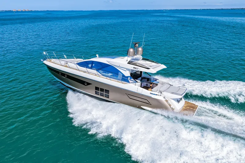 Slide: The Image of Luxury 2020 Azimut S6 yacht cruising on open blue waters. - 62
