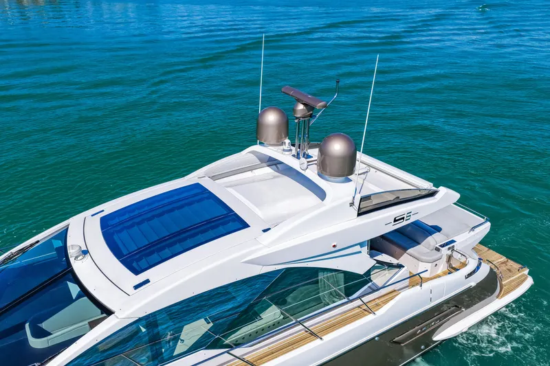 Slide: The Image of 2020 Azimut S6 yacht cruising on clear blue water, showcasing sleek design and luxury features. - 8