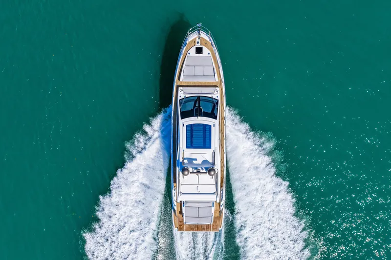 Slide: The Image of Aerial view of 2020 Azimut S6 yacht cruising on turquoise water. - 52