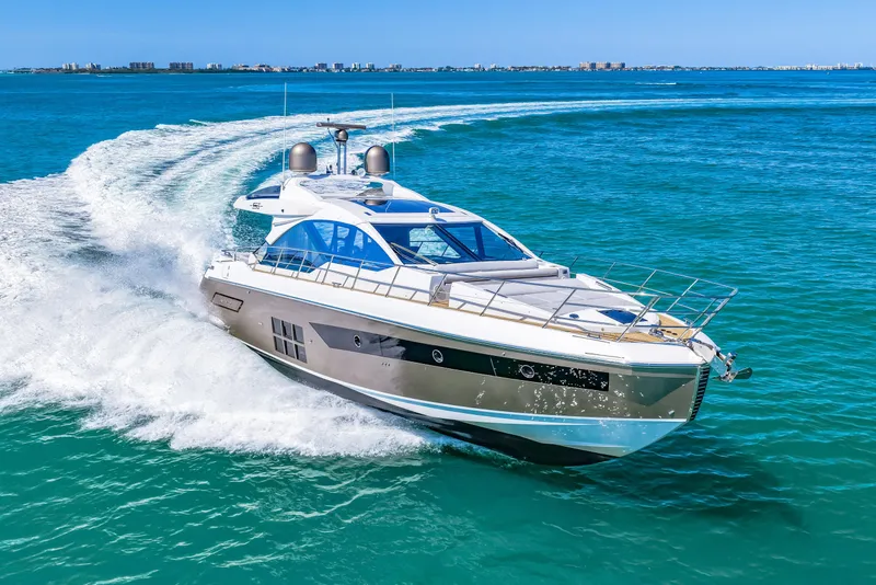 Slide: The Image of 2020 Azimut S6 yacht cruising on clear blue ocean waters. - 71