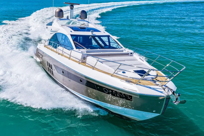 Slide: The Image of 2020 Azimut S6 yacht cruising on clear blue ocean waters. - 73