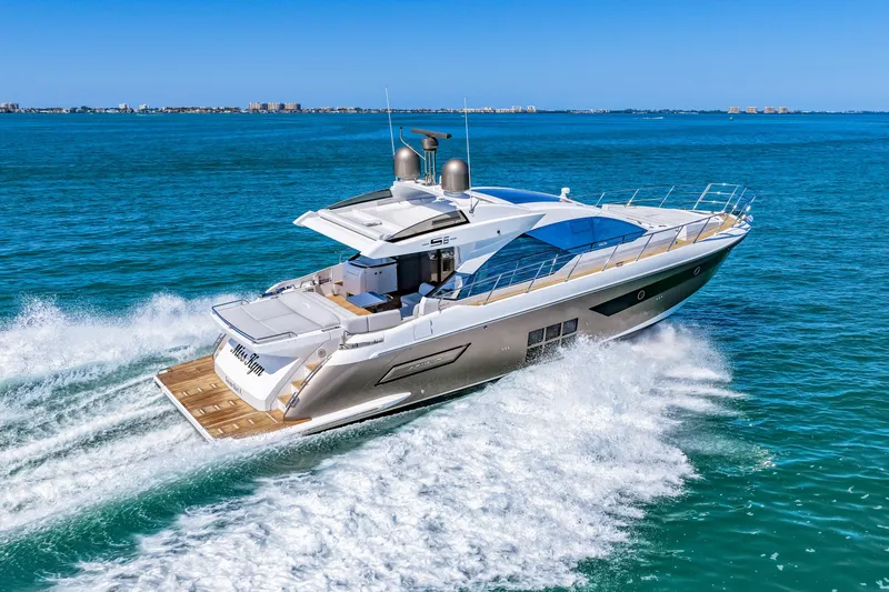Slide: The Image of 2020 Azimut S6 yacht cruising on open blue waters, showcasing sleek design and luxury. - 64