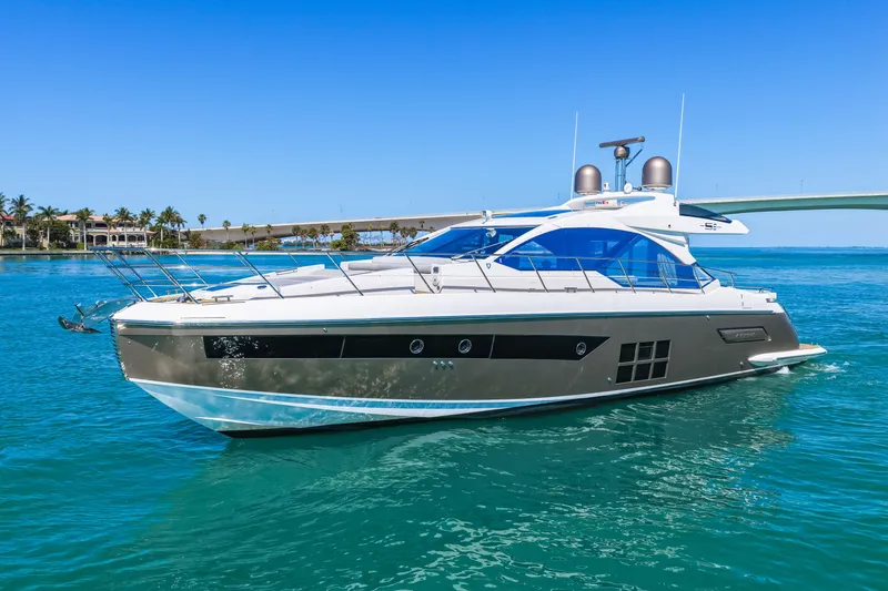 Slide: The Image of 2020 Azimut S6 yacht cruising on clear blue waters under a sunny sky. - 3