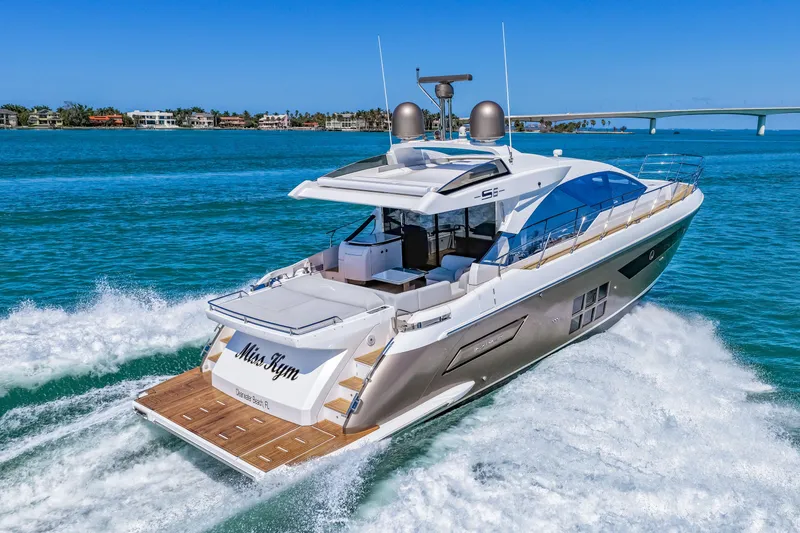 Slide: The Image of Luxury 2020 Azimut S6 yacht cruising on clear blue waters. - 47